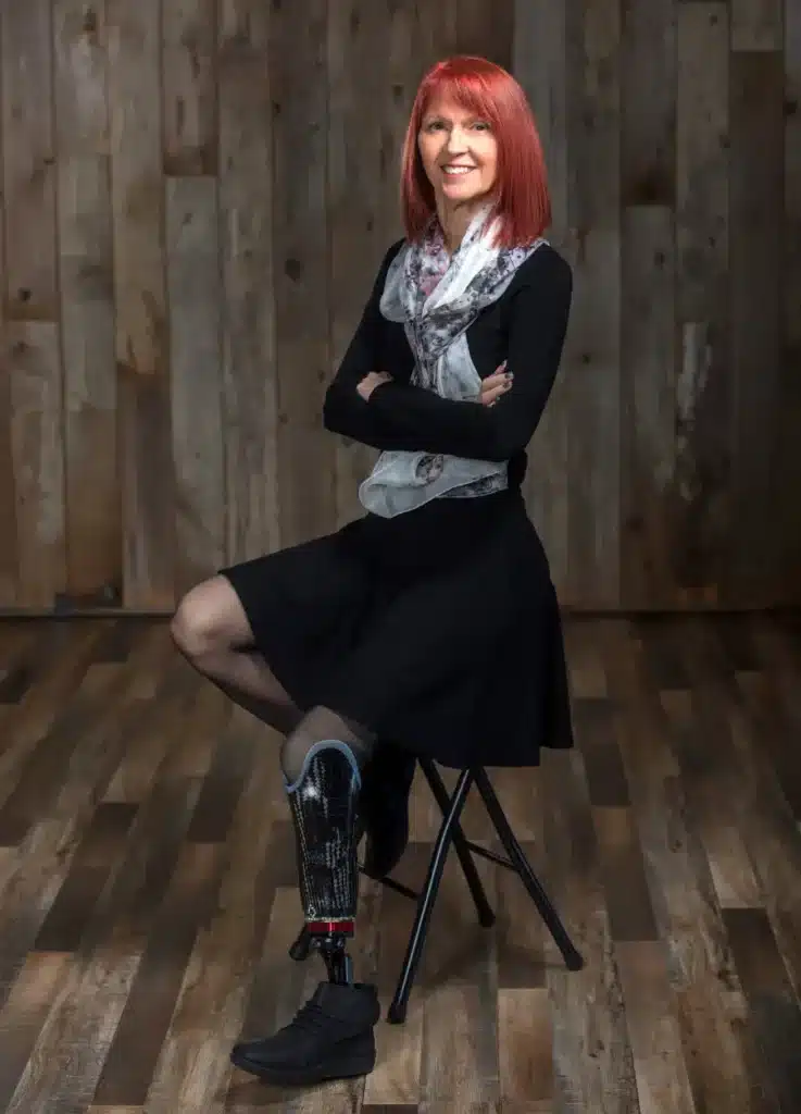 Paula Free, the founder of Power On With Limb Loss smiling for a photo
