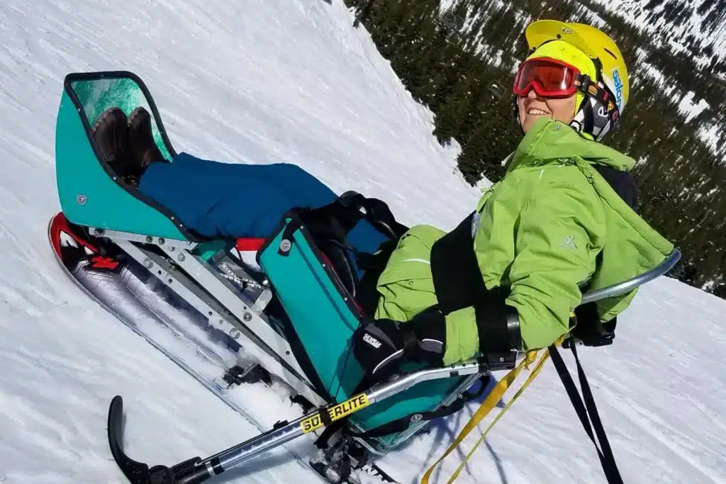 Paula smiling while adaptive skiing at Hoodoo Ski Area, Oregon